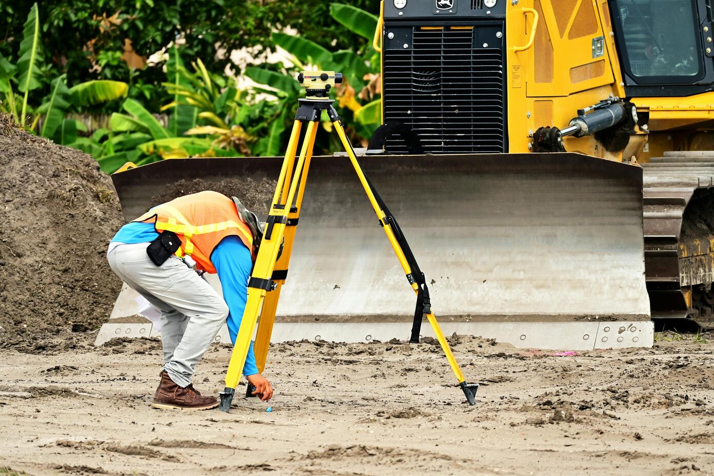 A person conducting construction staking