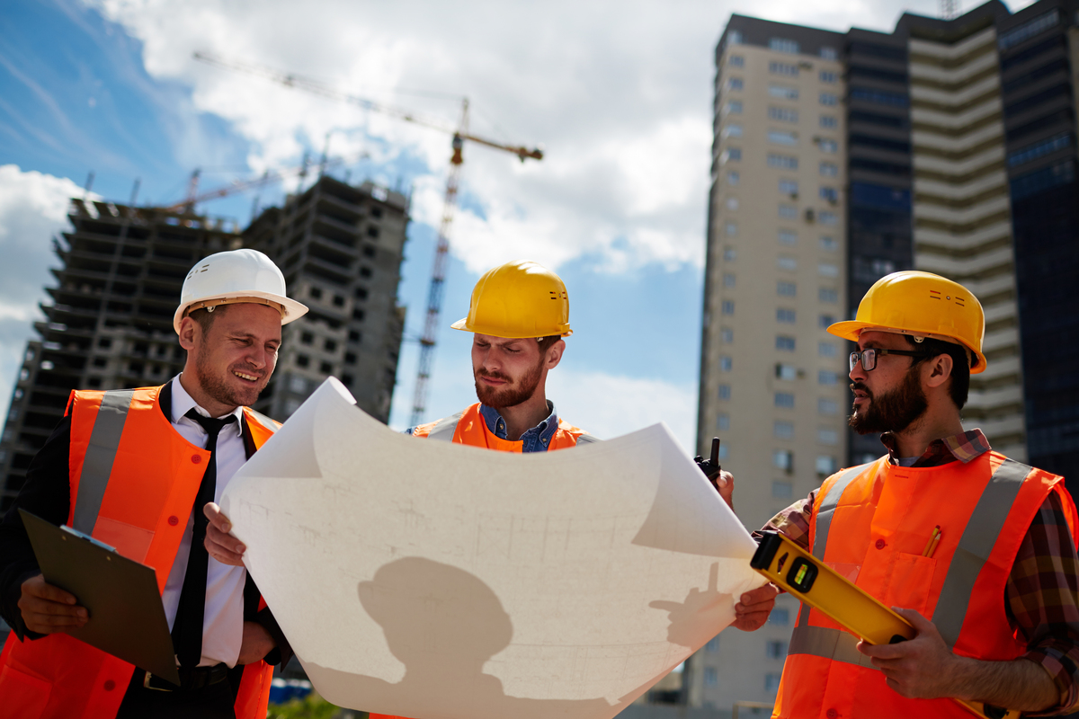 A group of men planning to do construction staking.