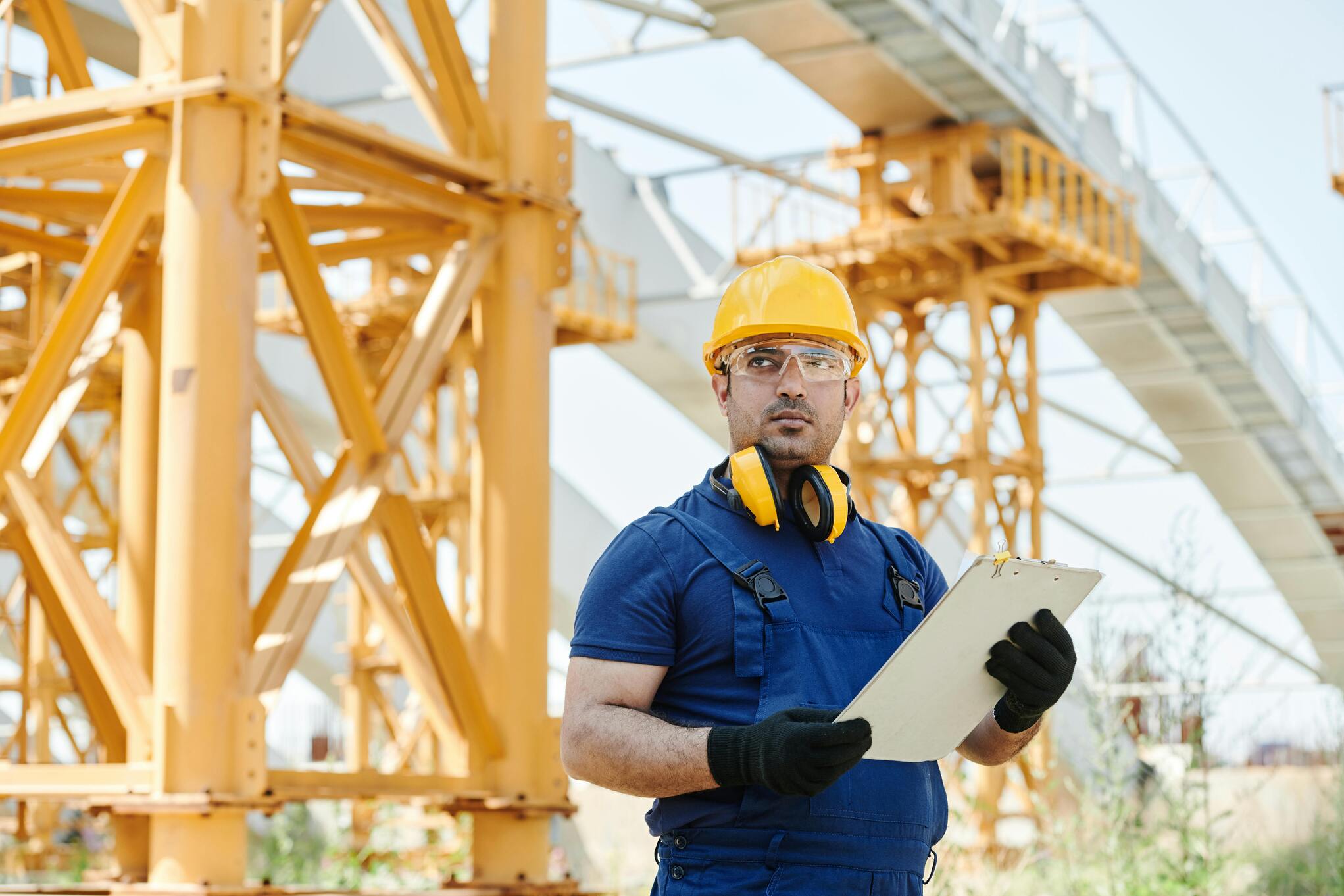 A skilled professional inspecting the construction staking