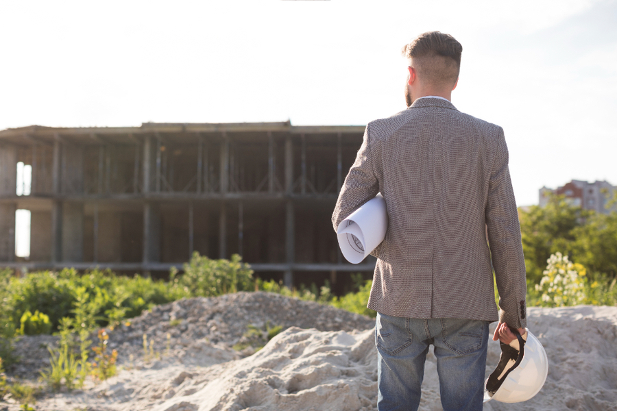 A leadman holding a construction layout