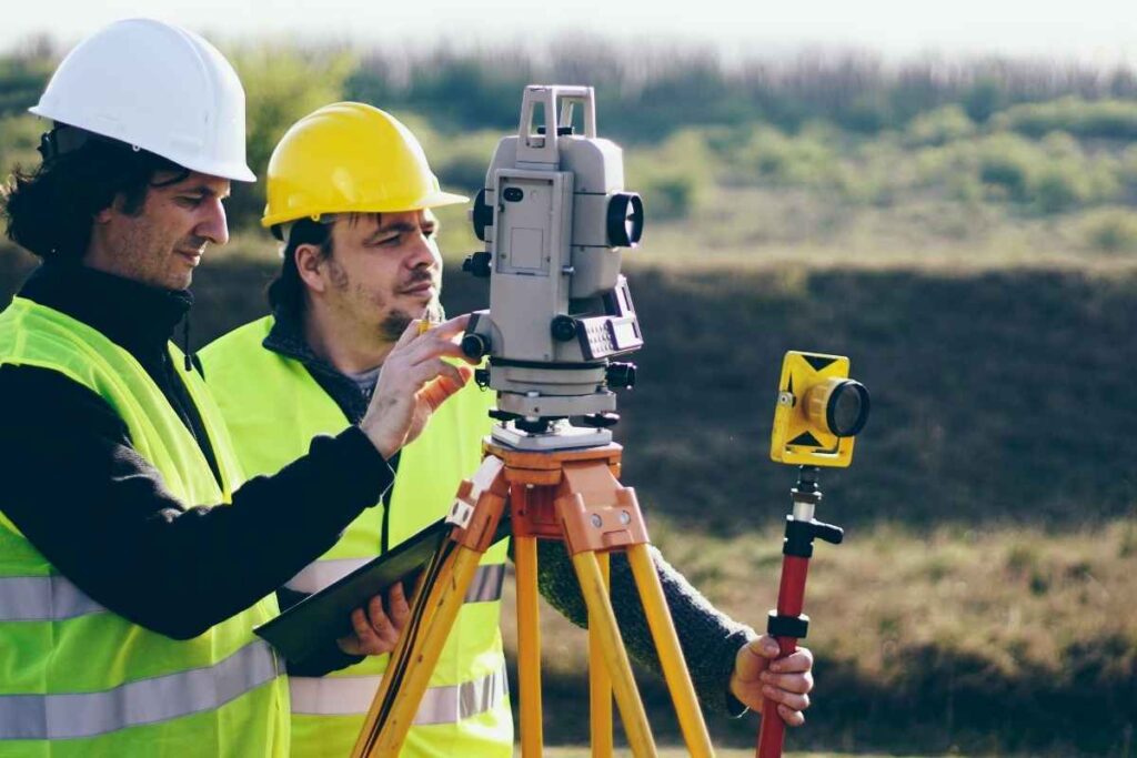 A geodetic engineer surveying a massive land