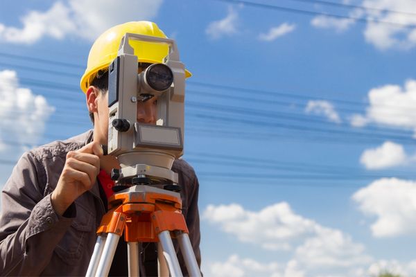 A technician performing a land survey