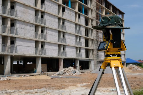 A land survey being done in a construction site