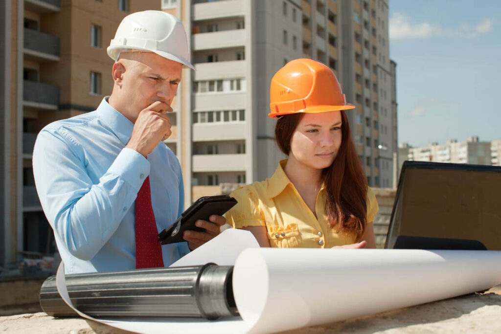 Professionals Discussing a Demolition Plan In Construction