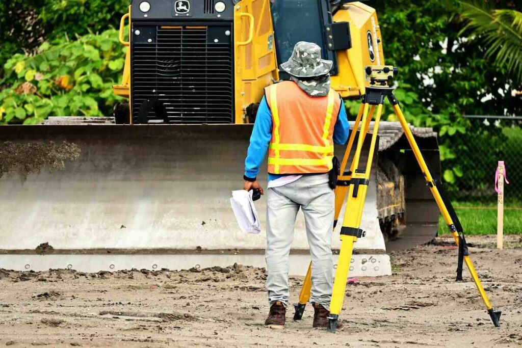 Surveyor showing The Essential Fundamentals Of Land Surveying