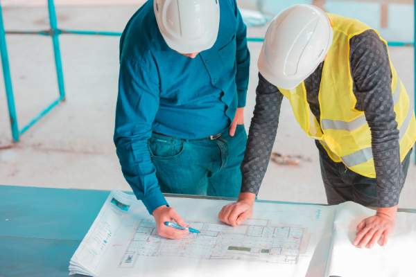 two colleagues doing site planning